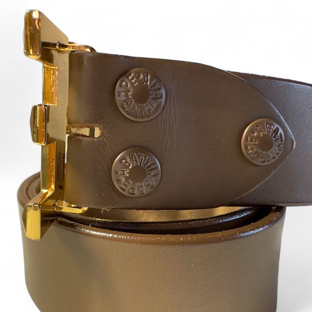 A Bathing Ape (BAPE) - brown leather belt gold pendant